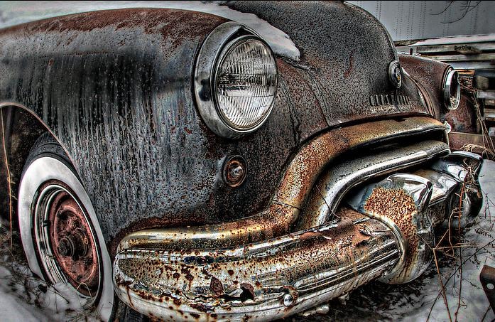 Rusted vintage car front close-up